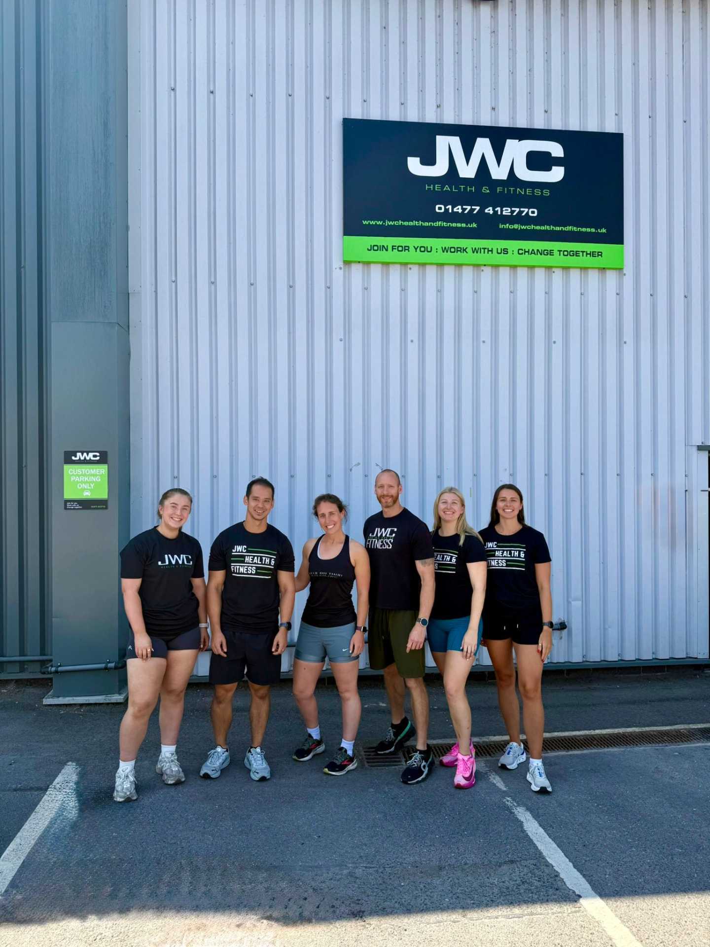 The JWC Health & Fitness coaching team outside the Holmes Chapel facility