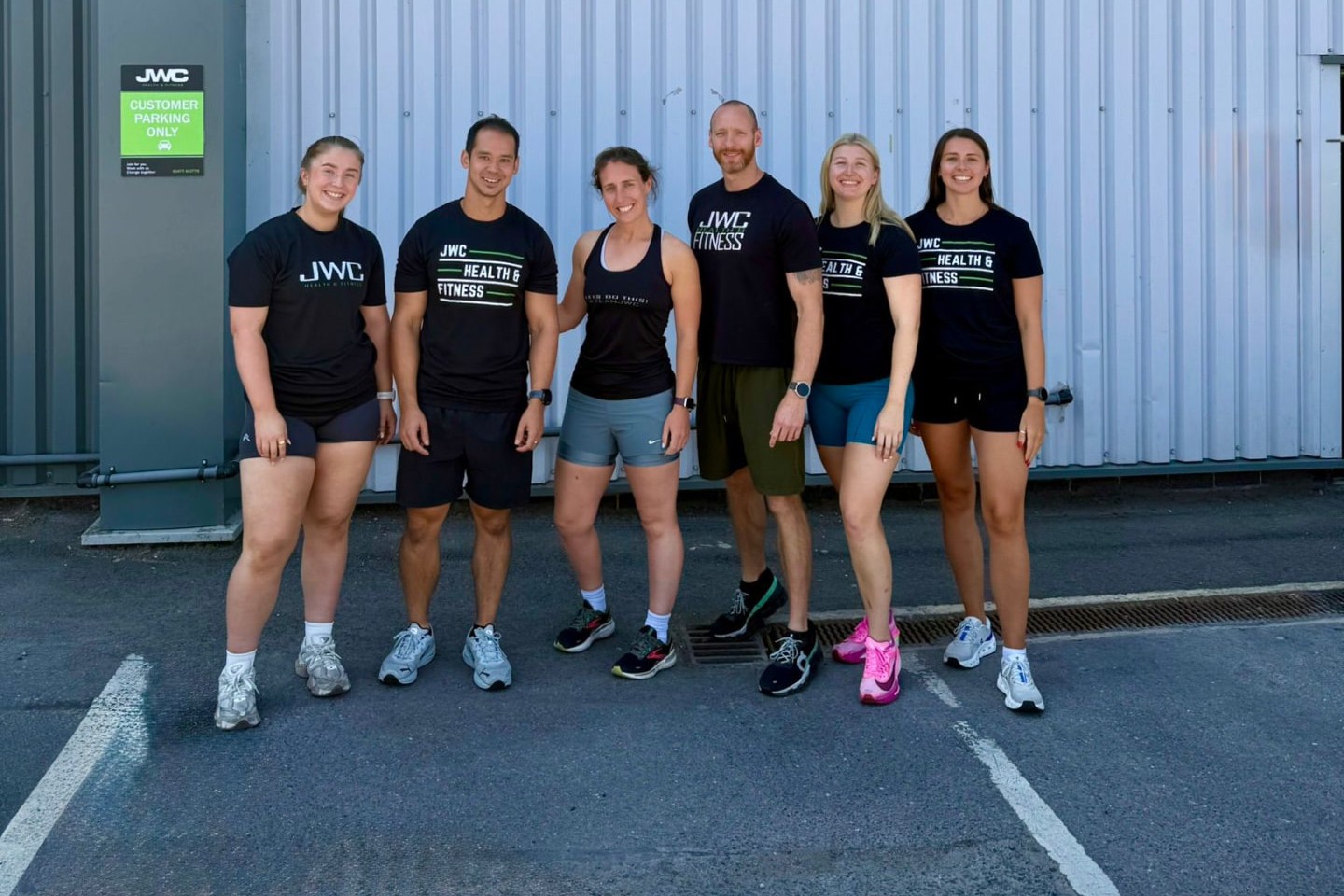 The JWC Health & Fitness coaching team outside the Holmes Chapel facility
